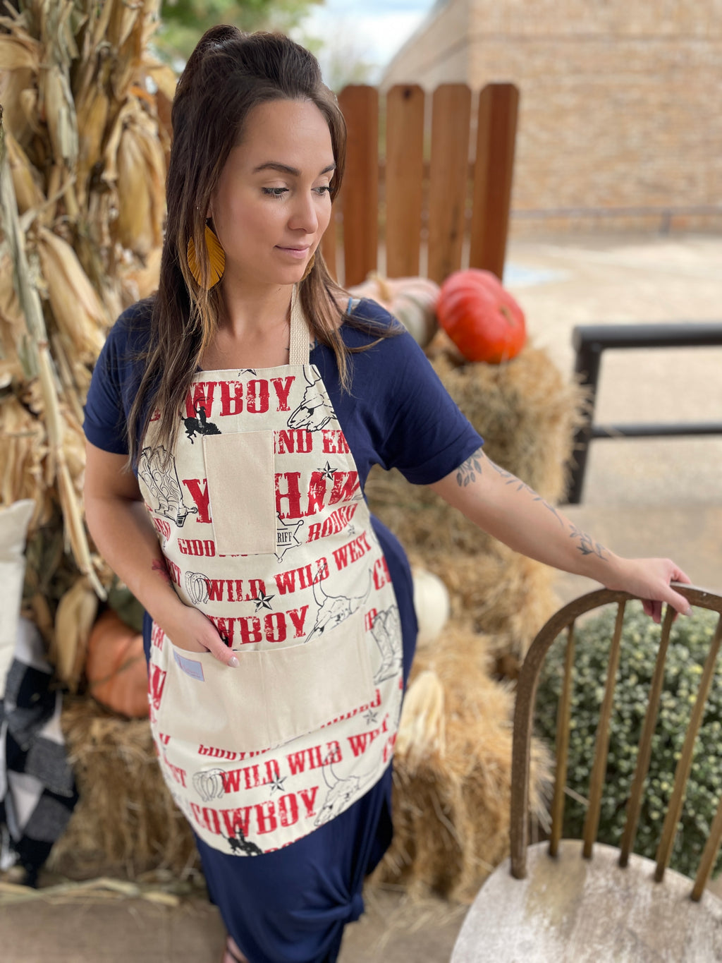 Ranchy Life Jane Apron by Two Medium Sized Ladies Texas Cowboy Sheriff horses cattle horseshoes kitchen baking on model